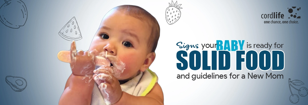 baby eats solid foods